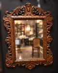 Ornate Carved Wall Mirror with Scrollwork Crest